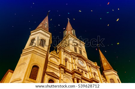 New Orleans St Louis Cathedral on Mardi Gras celebrations with confetti in the air.
