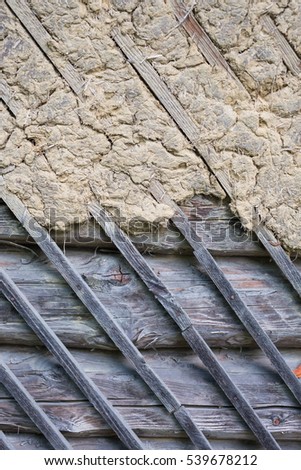Abstract background, log cabin wall, natural background, clay and wood. Gray beige colour. Nice texture. Plenty of copy space for text or picture.