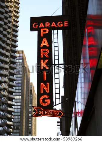 Neon Parking Garage Sign in an Urban Location