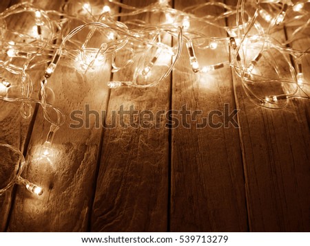 Christmas rustic background - old wood with colorful lights and free text space