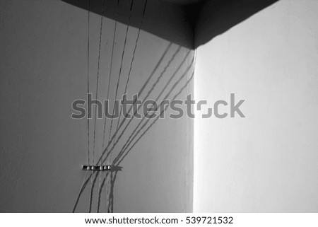 Abstract rope strings and plaster wall with shados. Abstract background