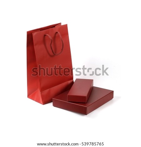 Paper red bag and two red boxes isolated on white background
