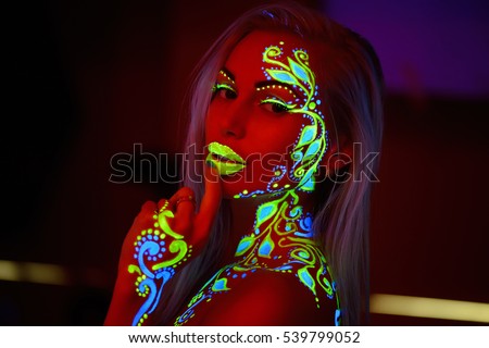 the girl in the neon light pictures neon colors on the body
