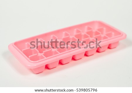 Ice Tray. Plastic rectangular Divided into compartments.