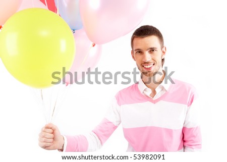 Image of attractive man with colorful balloons looking at camera