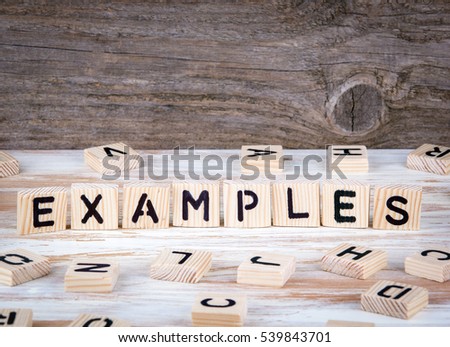 Examples from wooden letters on wooden background
