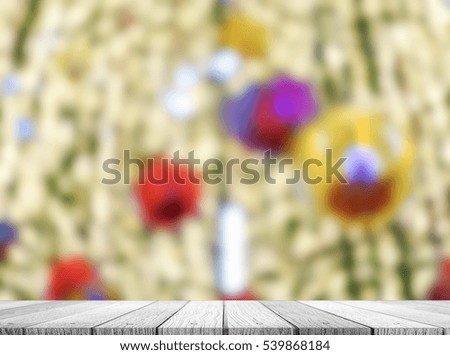 Wooden table top with Christmas lights background blurred use for products display