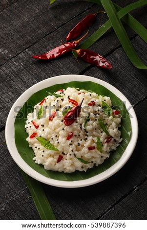 Overhead view-Tasty and Delicious Homemade curd rice served in plate,