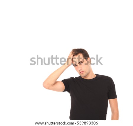 Side view of young man with headache touching forehead on white background. Clean hair because of shampoo. Mock up and skin care