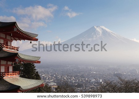 Fuji volcano mountain with behind red pagoda temple, Japan