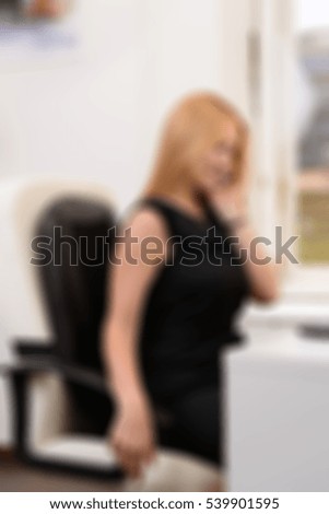 Blond office woman theme creative abstract blur background with bokeh effect