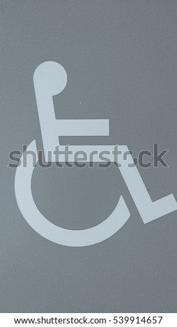 Gray disable toilet sign or symbol.