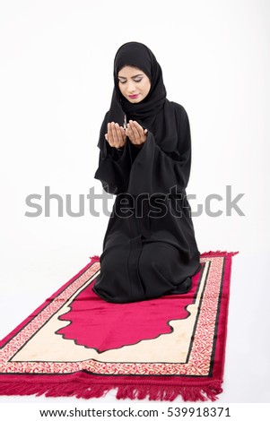 muslim woman praying on white background