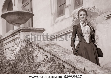 Romantic young beautiful lady outdoors. Victorian style