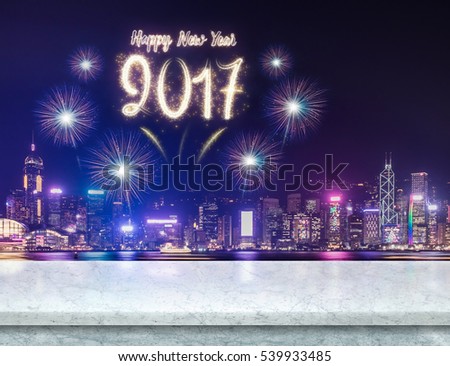 Happy new year 2017 fireworks over cityscape at night with empty white marble table,Mock up template for display or montage of product for social media advertising Royalty-Free Stock Photo #539933485