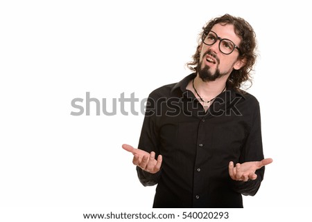Handsome Caucasian man looking confused while thinking