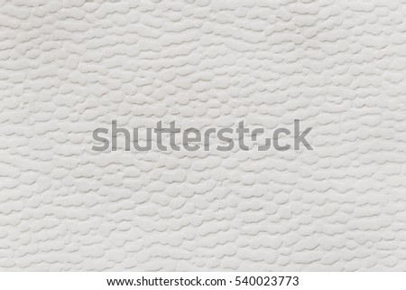 Texture of white paper with a volume stamping.