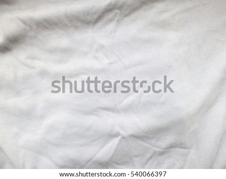 White fabric with folds texture Royalty-Free Stock Photo #540066397