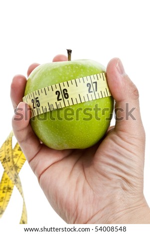 green apple and Tape Measure close up