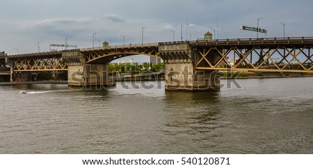 Burnside Bridge - Bascule bridge that spans the Willamette River, Portland, OR. It is listed in the National Register of Historic Places. Royalty-Free Stock Photo #540120871