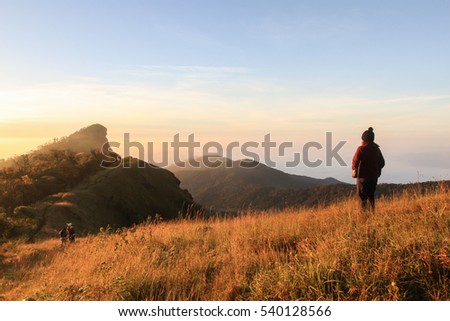 Young girl see mountain view in sunset
