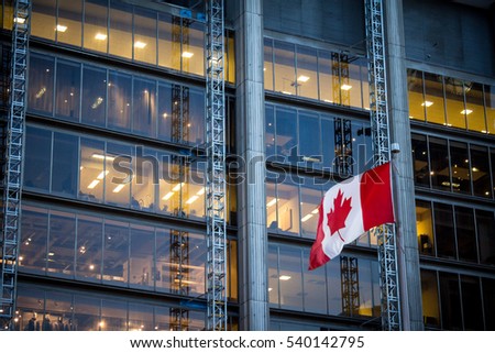 Canadian flag in front of a business building in Toronto, Ontario, Canada