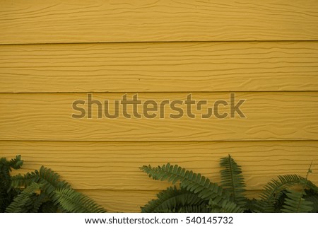 yellow background and green leafs.