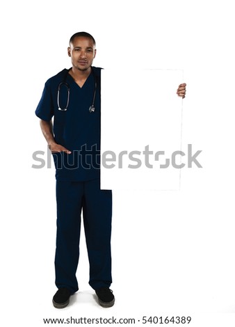 Male surgeon doctor in scrubs holding up a blank sign isolated on white background 