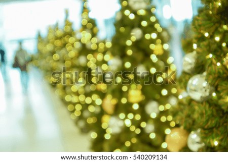 abstract blurry scene of shopping mall and people on christmas time as background