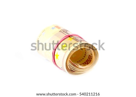 a pack of euro banknotes rolled into a tube and tied with a rubber band