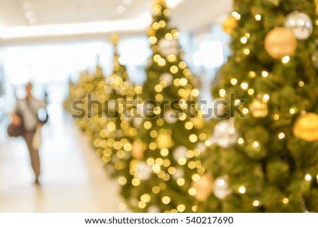 abstract blurry scene of shopping mall and people on christmas time for background