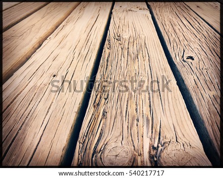 Old rustic wooden floor or table surface background. Vintage film look and feel