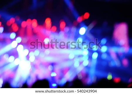 Defocused entertainment concert lighting on stage, blurred disco party.