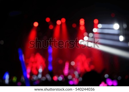 Defocused entertainment concert lighting on stage, blurred disco party.
