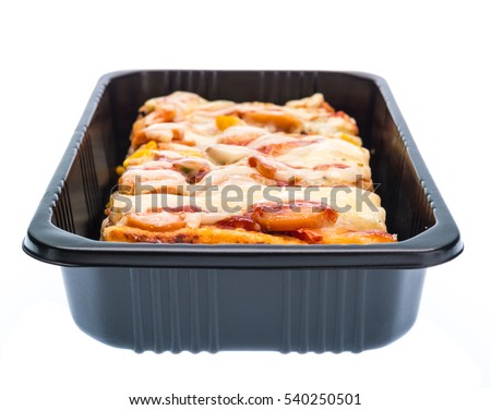 Delicious pizza in plastic container isolated on white background.