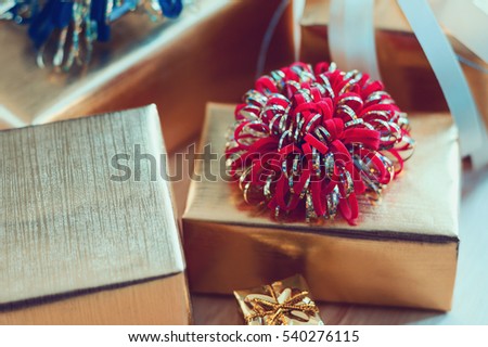 golden gift box on wood table for christmas background