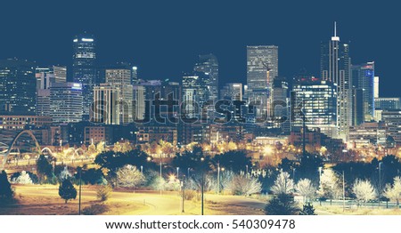 Retro toned Denver downtown skyline at night, Colorado, USA.