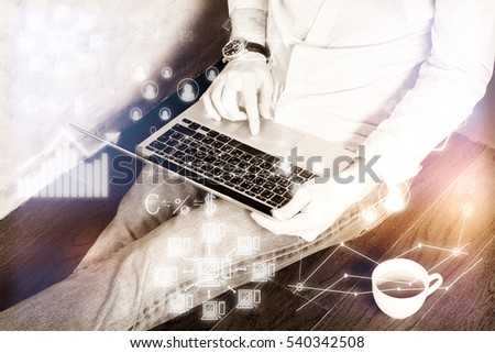 Businessman using laptop with creative business computing pattern. Technology concept. Filtered image