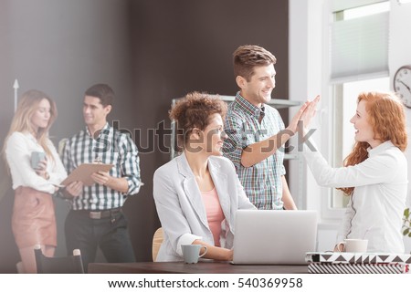 People working in positive environment, woman using laptop Royalty-Free Stock Photo #540369958