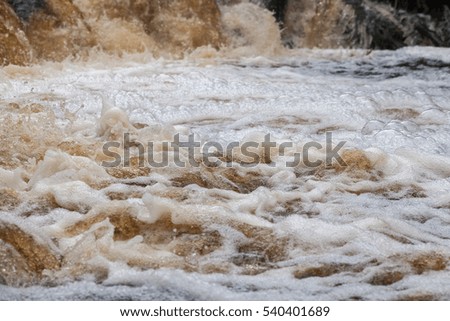 River rapids with mixed forest on the background near the White-pillars waterfall, Karelia, Russia