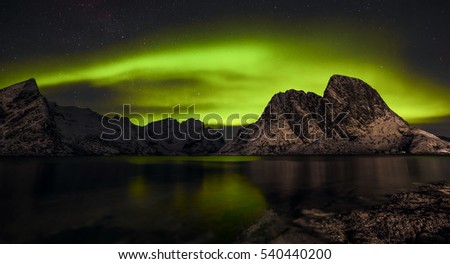 Aurora borealis (Polar lights). View to Steinfjord on Senja island - Lofoten islands, Norway 