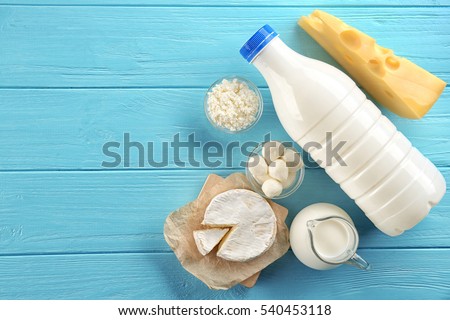 Dairy products on wooden background, top view Royalty-Free Stock Photo #540453118