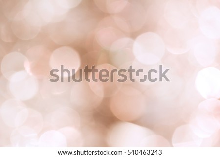 Blurred Christmas background with pink and white bokeh 