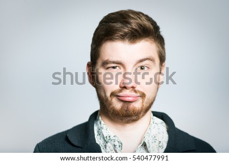 Attractive businessman bored, stylish, isolated on a gray background manager