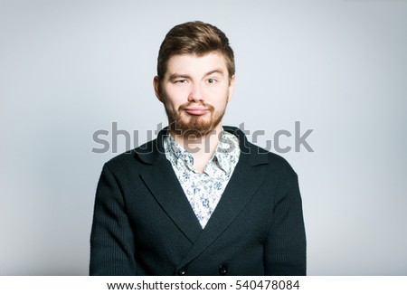 Attractive businessman bored, stylish, isolated on a gray background manager
