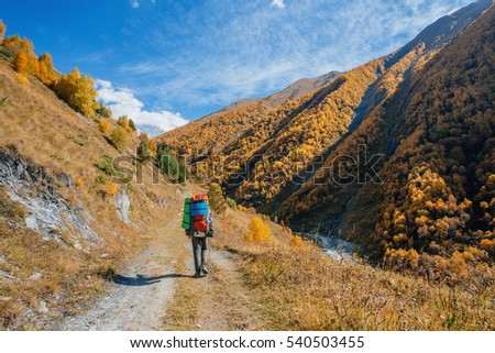 Hiker whith backpack in Caucasian mountains.
This is a photo from my travel in the Georgia. My track passed through the mountains of Mestia. Royalty-Free Stock Photo #540503455