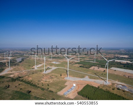 Bird Eye View High angle shots Wind turbine in a field of Thailand Aerial view of drones.