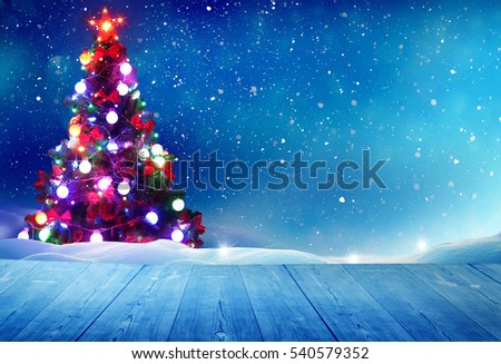 Merry Christmas and happy New Year greeting background with table .Winter landscape with snow and Christmas tree