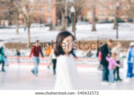Abstract blur ice-skating people in park for background
