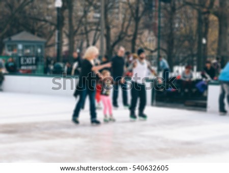 Abstract blur ice-skating people in park for background
